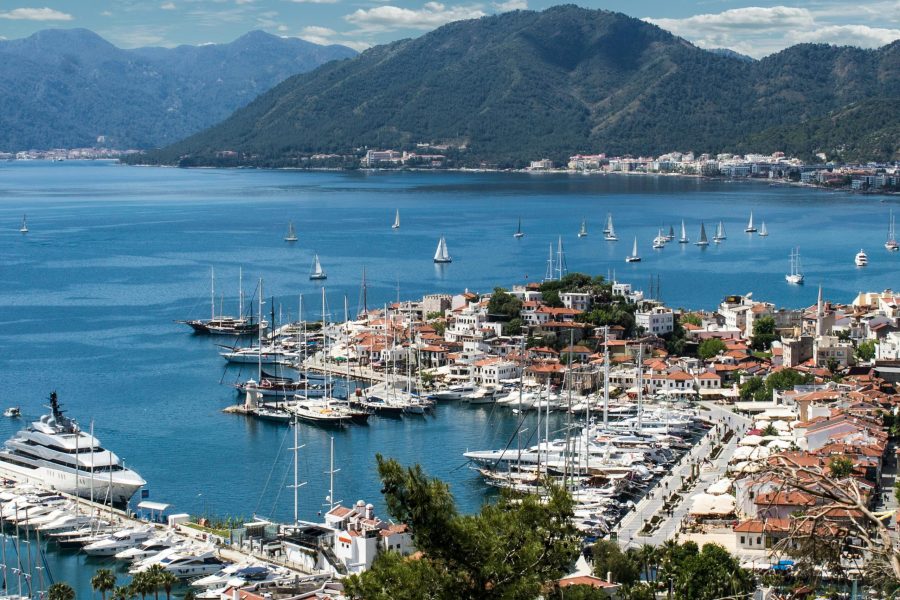 Breathtaking view of Marmaris harbor with yachts and sailboats under a clear sky.